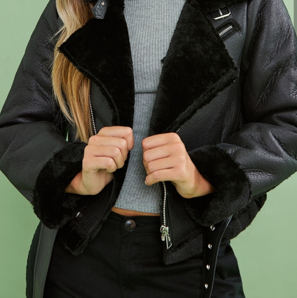 Black crop aviator jacket.